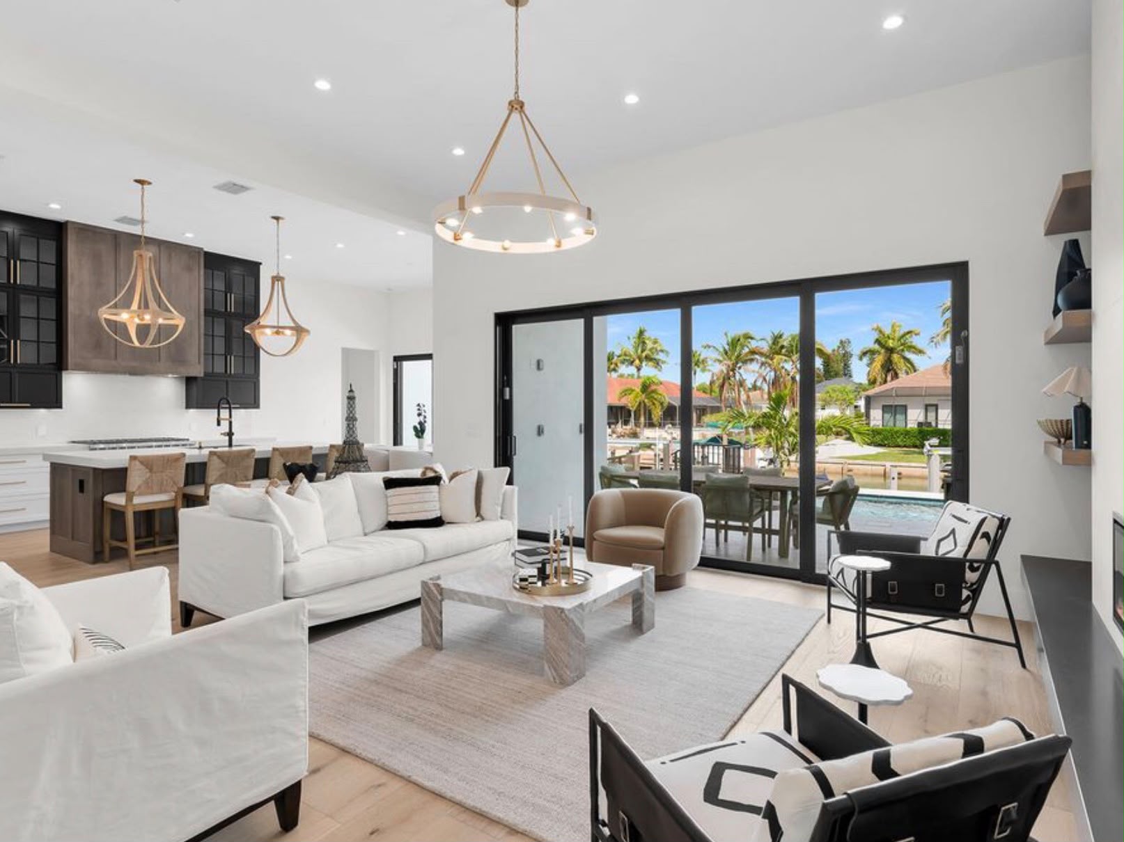 Living room with pool view cleaned by The Golden Touch Shine Co